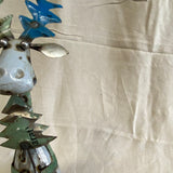 Zittende eland van blik