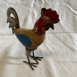 Kleine haan van blik en hout