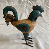 Kleine haan van blik en hout