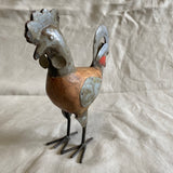 Kleine haan van blik en hout