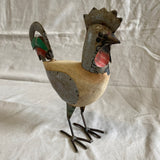Grote haan van blik en hout